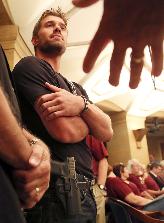 Glock owner at State Capitol hearing. Photo by David Joles, StarTribune.